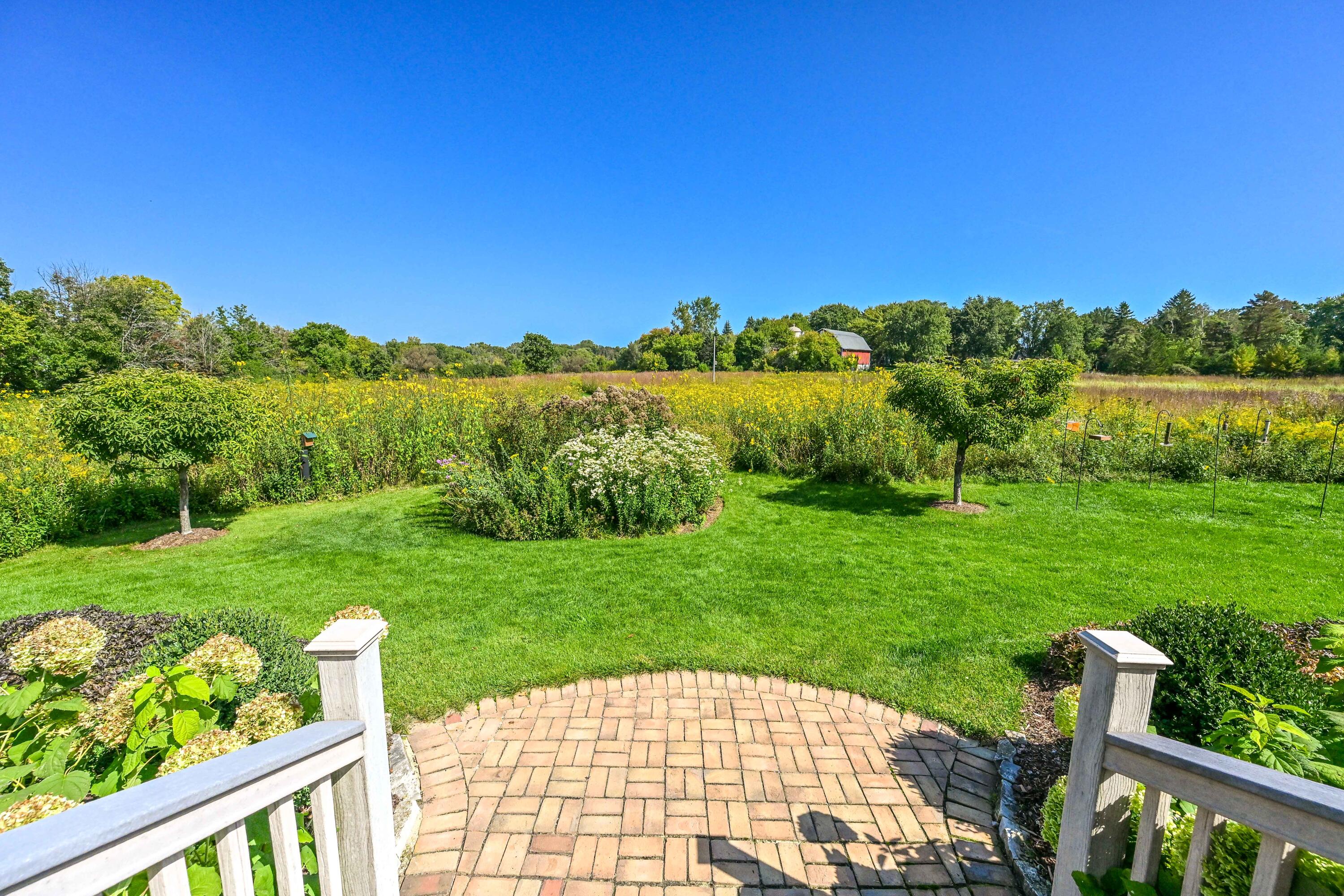 3200 West Bonniwell Road Mequon, WI 53097 - Photo 34 of 77 Rear deck, overlooking seasonal meadows and gardens