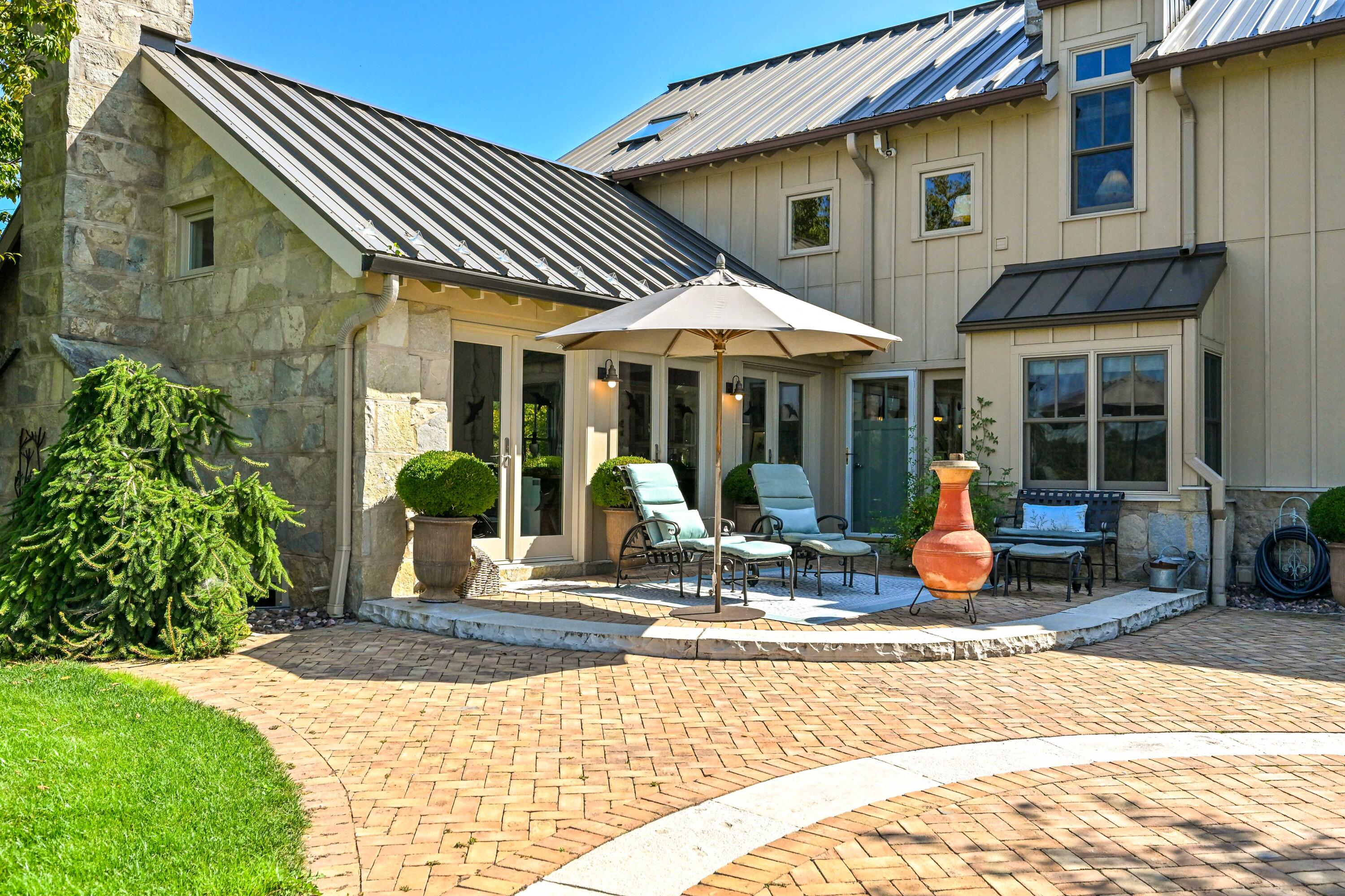 3200 West Bonniwell Road Mequon, WI 53097 - Photo 35 of 77 Rear brick patio, simply stunning.