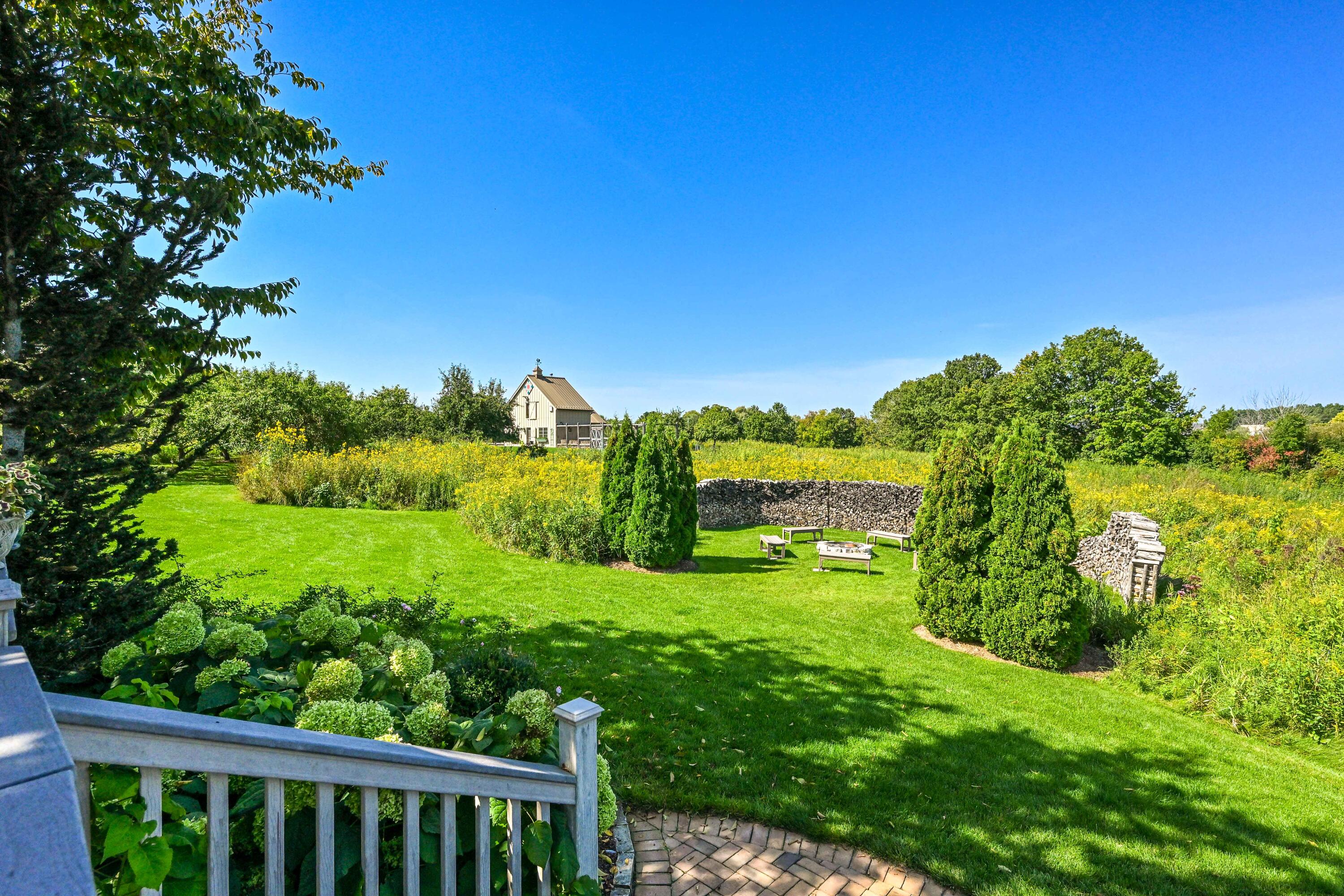 3200 West Bonniwell Road Mequon, WI 53097 - Photo 43 of 77 View from deck to grand firepit.
