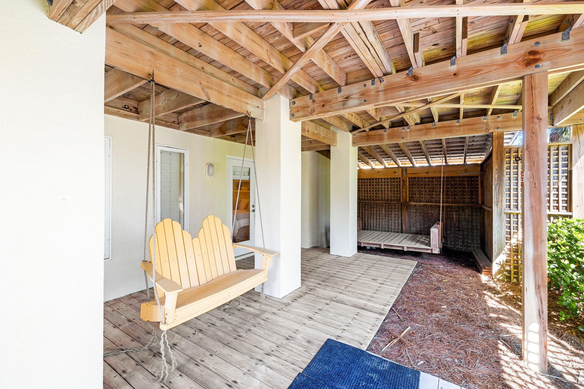 24 Bramble Grove Place Santa Rosa Beach, FL 32459 - Photo 21 of 89 a view of a porch with wooden floor and a yard