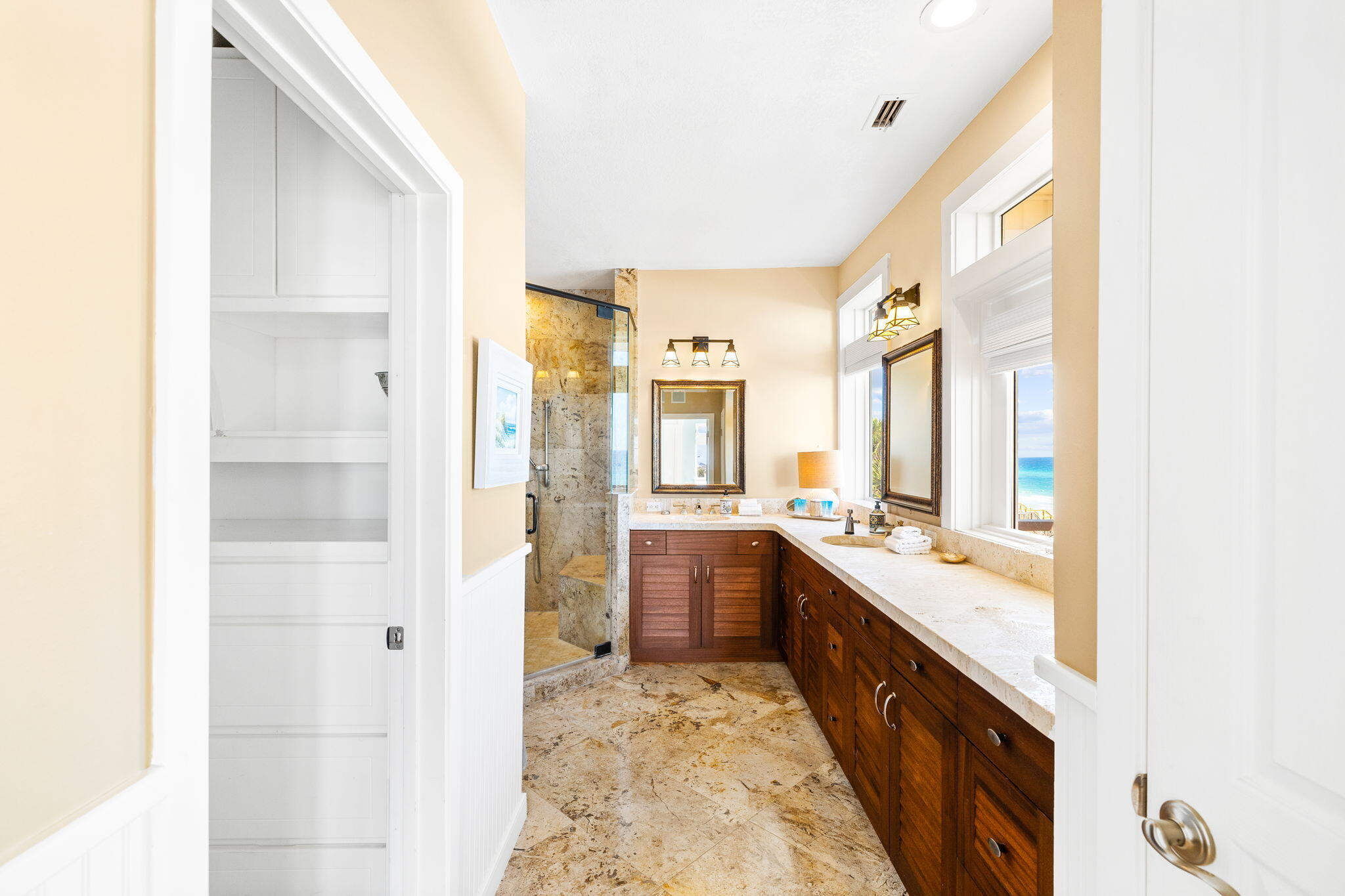 24 Bramble Grove Place Santa Rosa Beach, FL 32459 - Photo 54 of 89 a large bathroom with a granite countertop double vanity sink a mirror and a bathtub