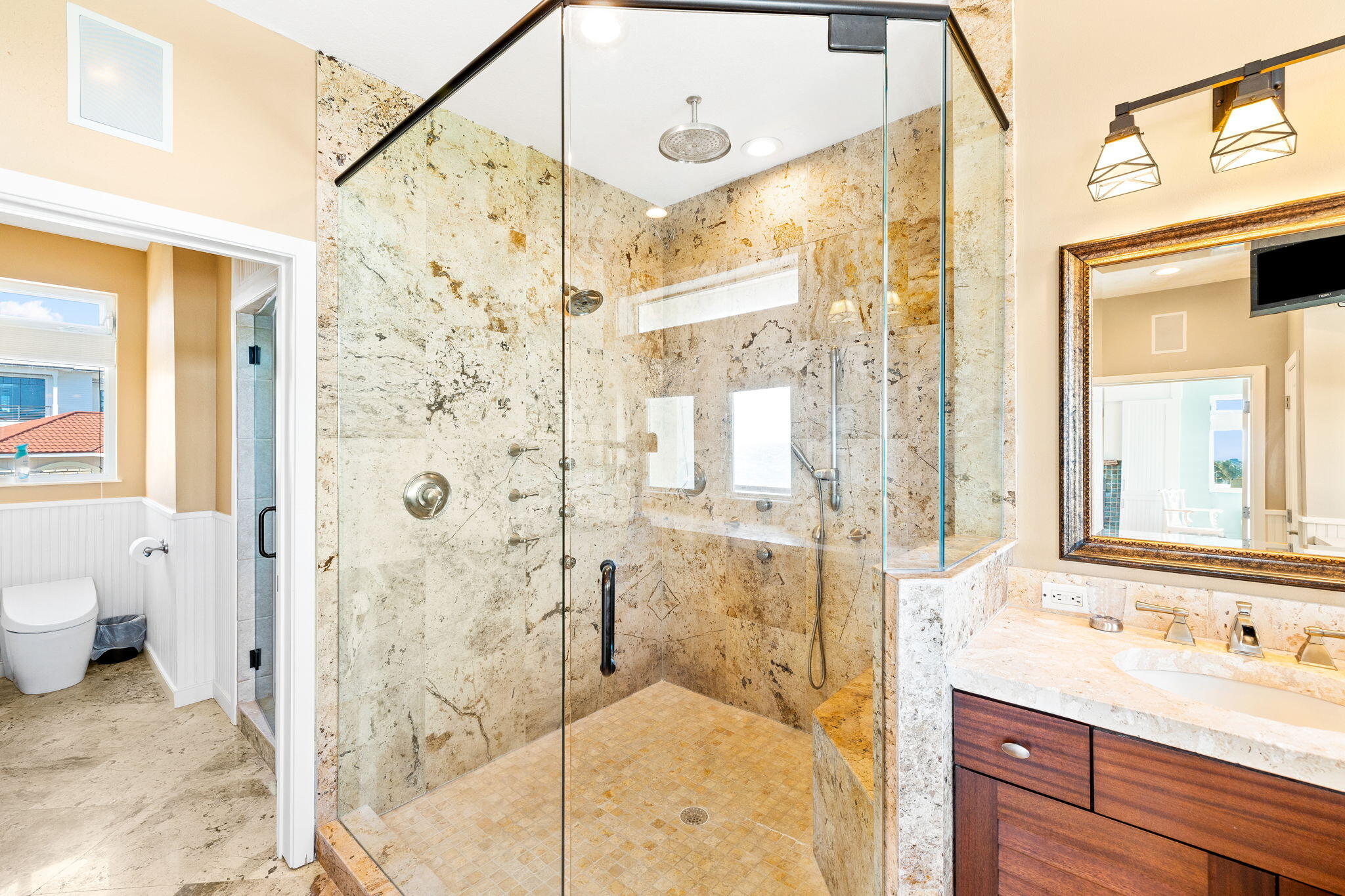 24 Bramble Grove Place Santa Rosa Beach, FL 32459 - Photo 59 of 89 a bathroom with a granite countertop sink a mirror a shower and a toilet
