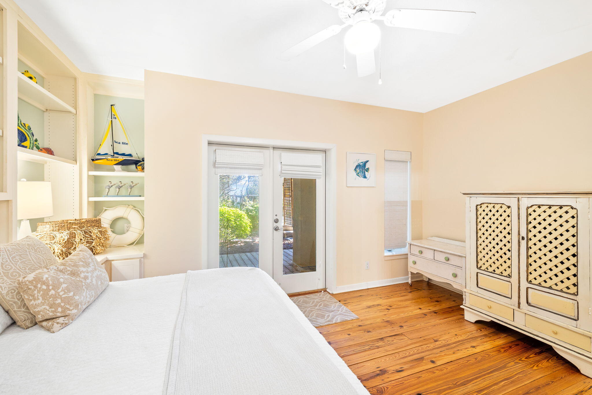 24 Bramble Grove Place Santa Rosa Beach, FL 32459 - Photo 65 of 89 a bedroom with a bed and wooden floor