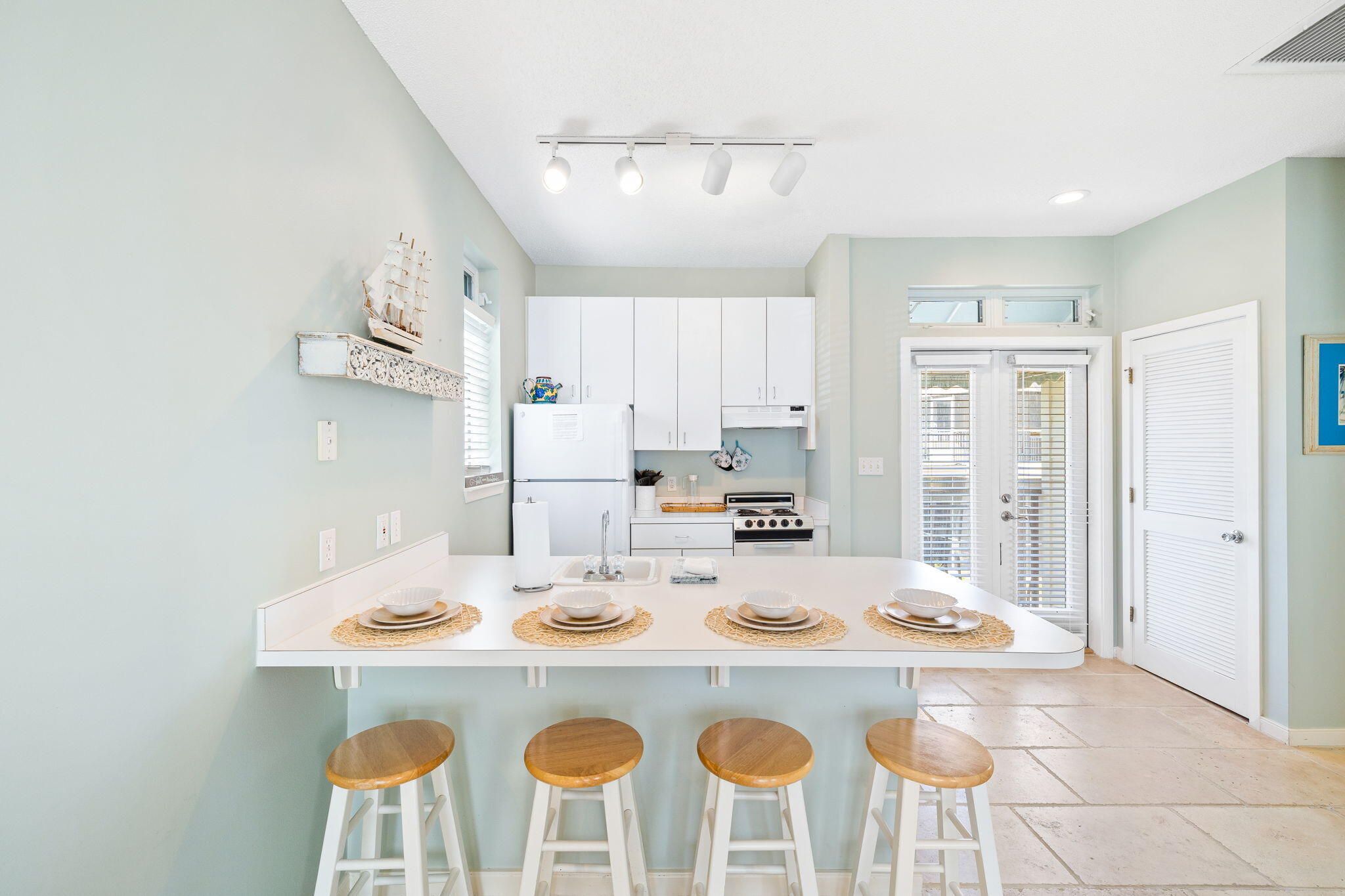 24 Bramble Grove Place Santa Rosa Beach, FL 32459 - Photo 76 of 89 a kitchen with a dining table and chairs