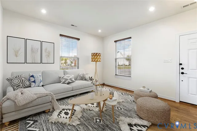 a living room with furniture and window