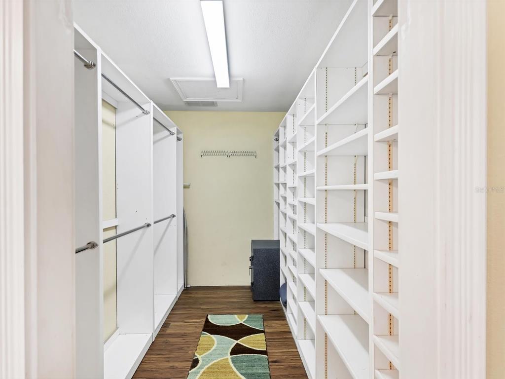 4708 Hidden River Road Sarasota, FL 34240 - Photo 25 of 67 a view of a hallway with windows
