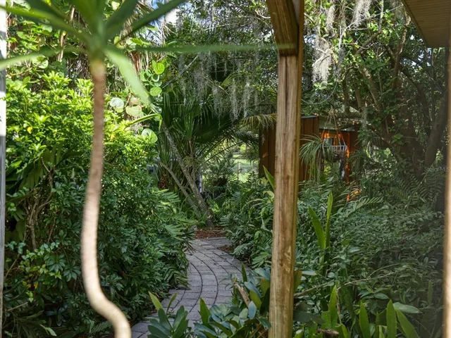 a backyard of a house with lots of green space