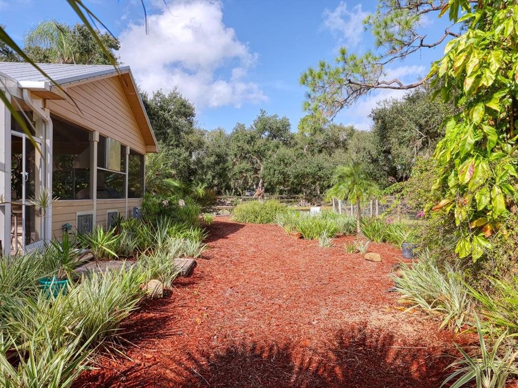 4708 Hidden River Road Sarasota, FL 34240 - Photo 51 of 67 a view of a garden with a house