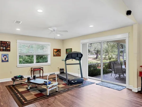 a view of a workspace with furniture and window