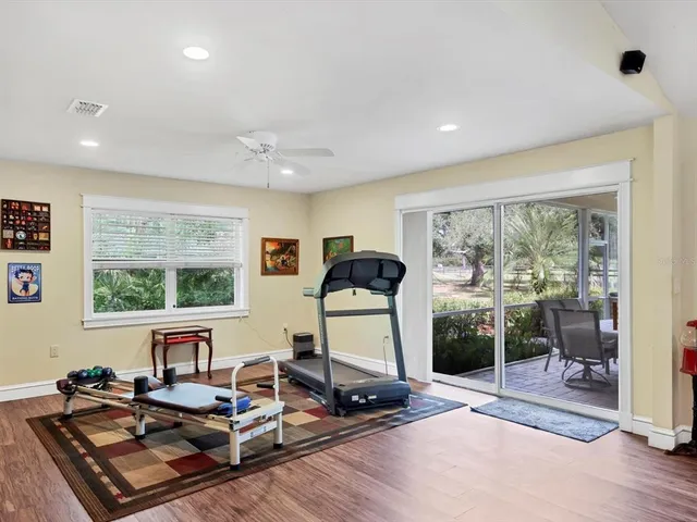 a view of a workspace with furniture and window