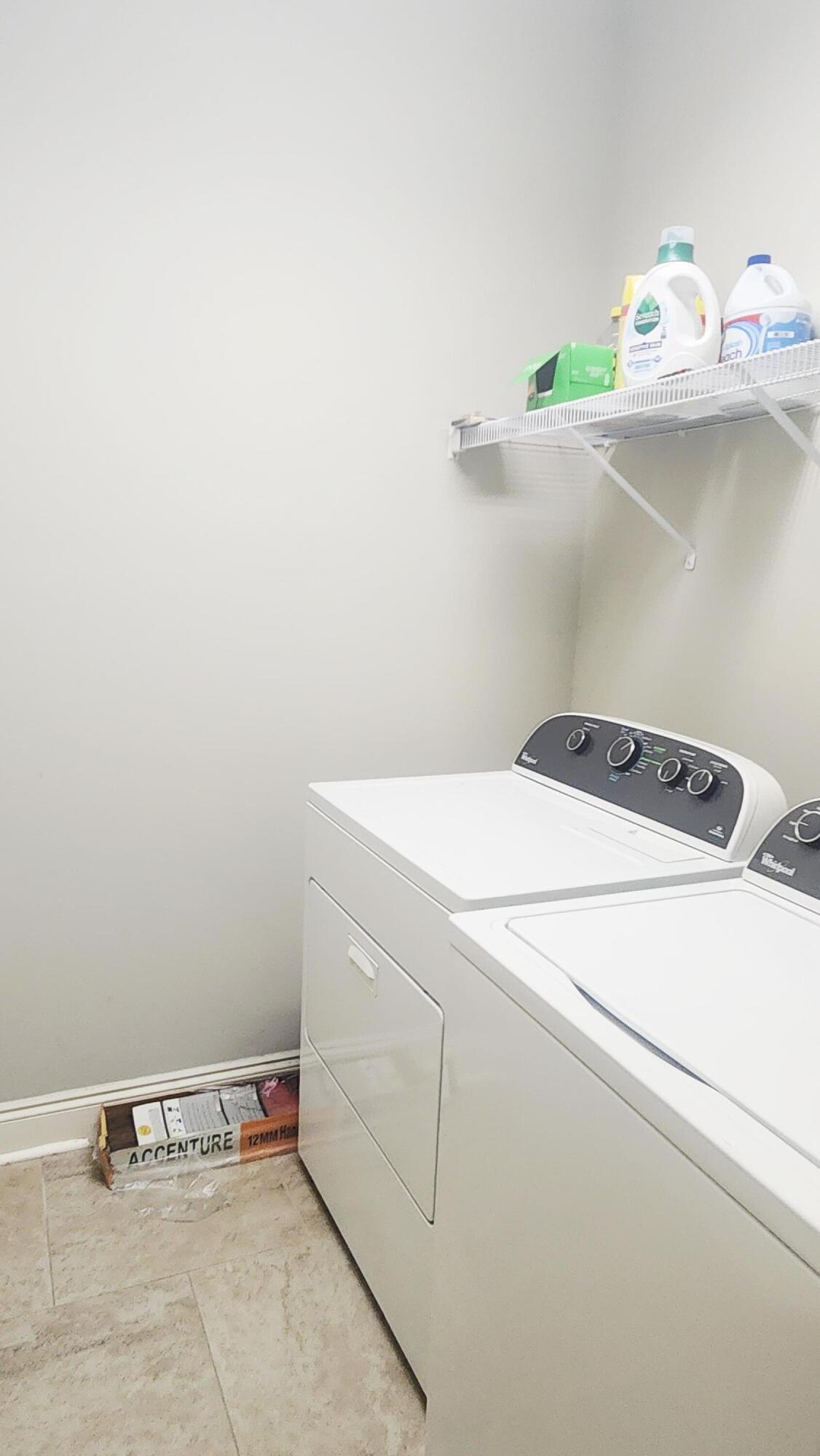 2133 Janet Street Navarre, FL 32566 - Photo 14 of 14 a utility room with dryer and washer