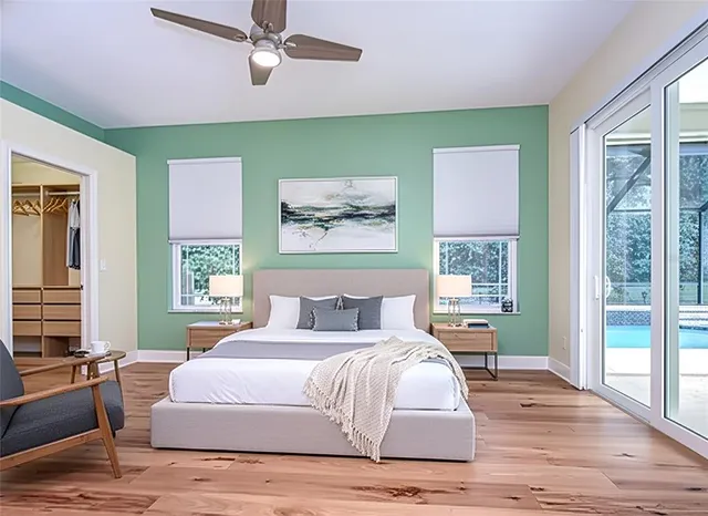 a bedroom with a large bed and a window