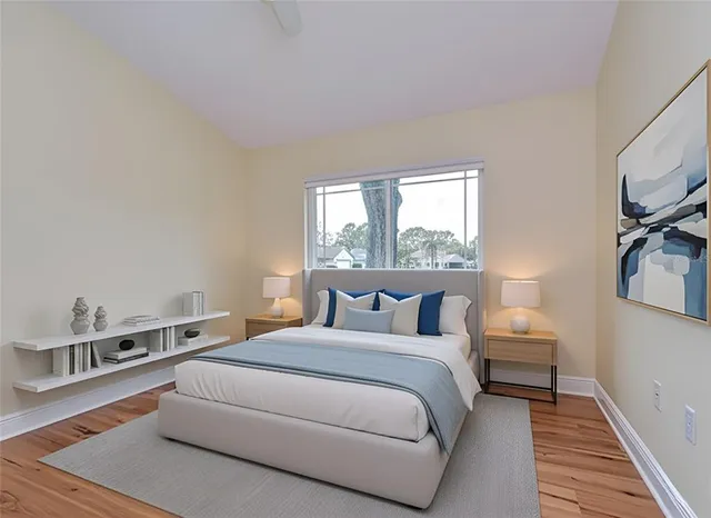 a bedroom with a bed and a window