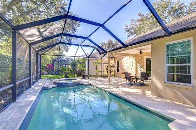 a view of swimming pool with a patio
