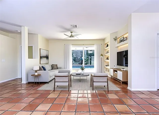 a living room with furniture and flat screen tv