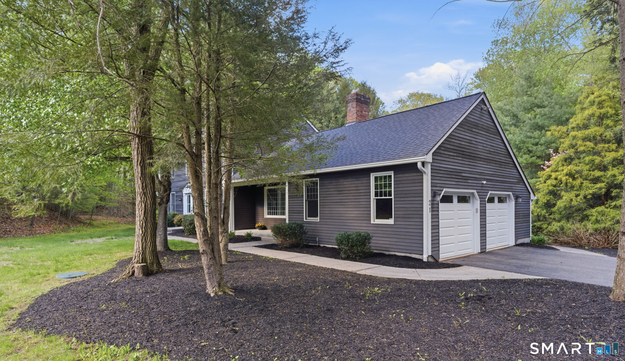 21 Greenwood Road North Granby, CT 06060 - Photo 2 of 40 a front view of a house with garden