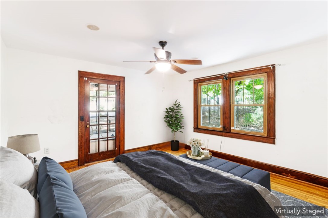 321 South Pine Street Walhalla, SC 29691 - Photo 16 of 32 Hardwood floors and a glass-paneled door enhance the allure of this sun-filled bedroom.