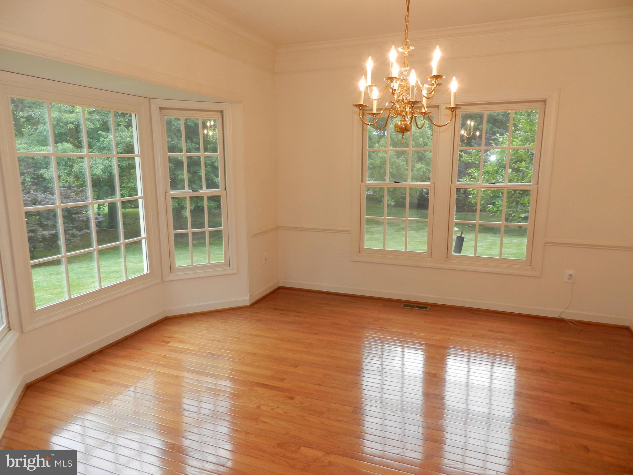 20006 Hickman Way Poolesville, MD 20837 - Photo 13 of 30 Large dining room features hardwoods and bump-outs