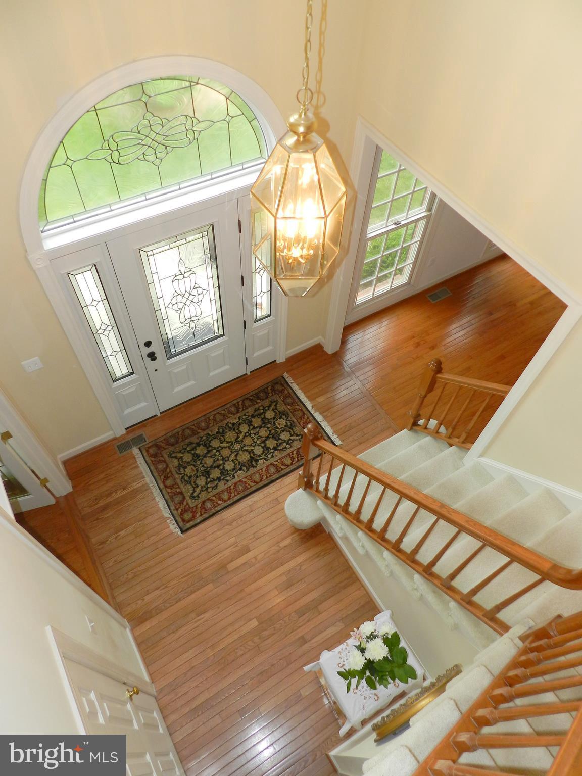 20006 Hickman Way Poolesville, MD 20837 - Photo 16 of 30 Two story foyer w/custom front door and windows