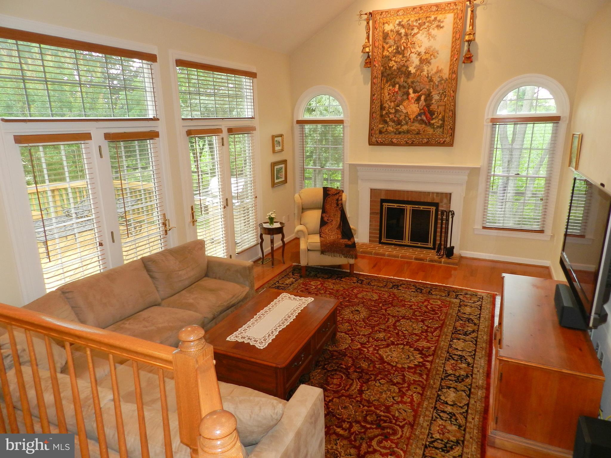 20006 Hickman Way Poolesville, MD 20837 - Photo 8 of 30 Sun-splashed family room w/wood-burning fireplace