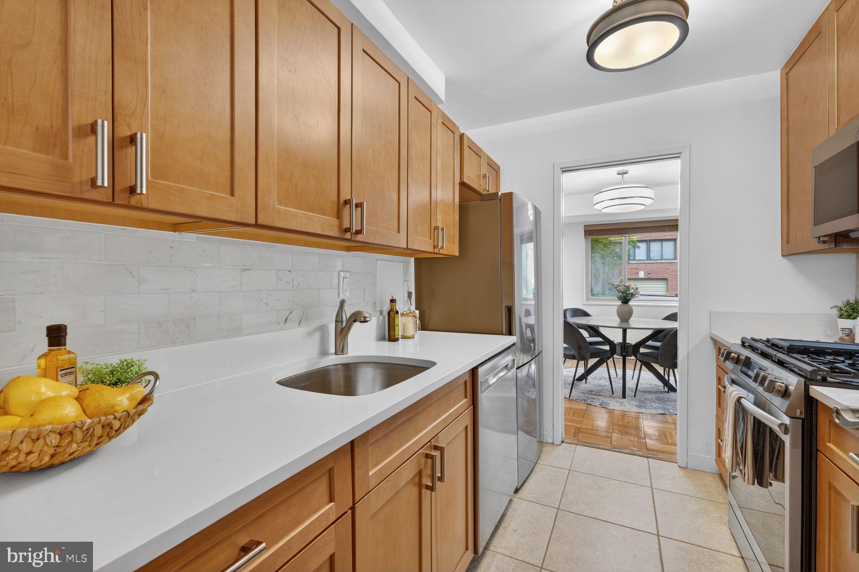 3900 Tunlaw Road Northwest, Unit 206 Washington, DC 20007 - Photo 7 of 28 Kitchen has lots of cabinets