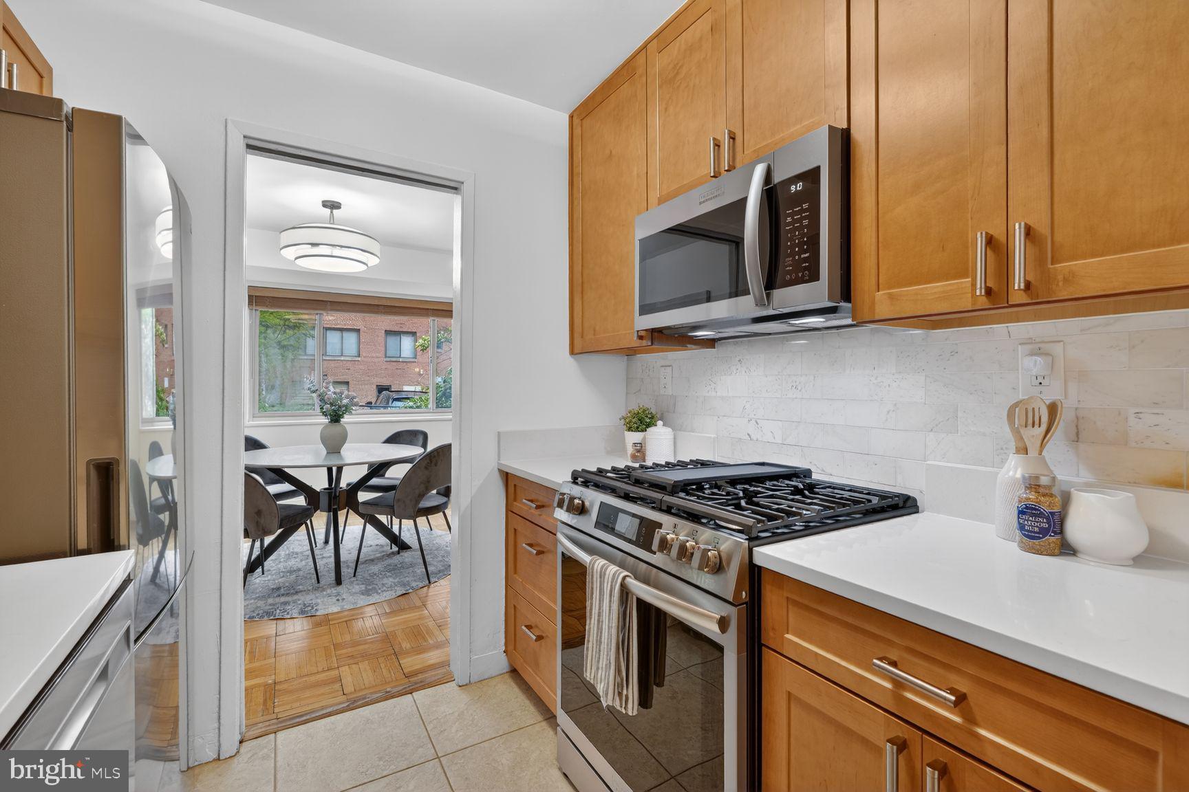 3900 Tunlaw Road Northwest, Unit 206 Washington, DC 20007 - Photo 8 of 28 Kitchen with stainless steel appliances