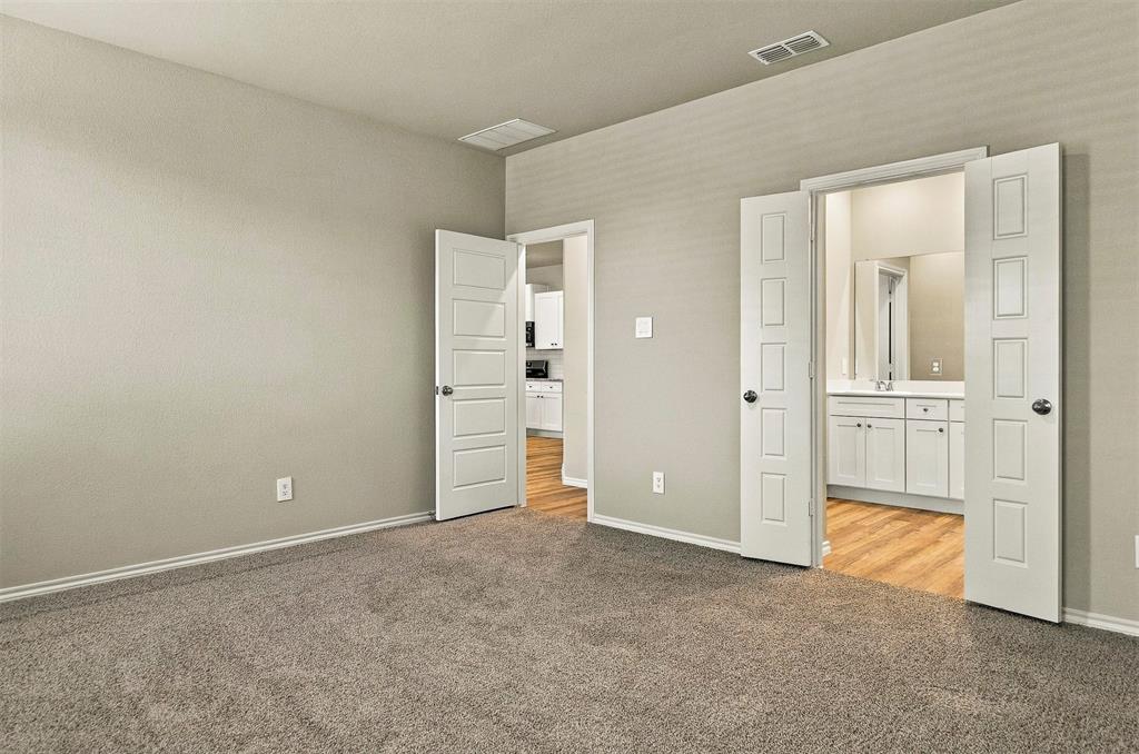 15932 Stableford Road Justin, TX 76247 - Photo 14 of 35 Plush carpet flooring with neutral wall paint