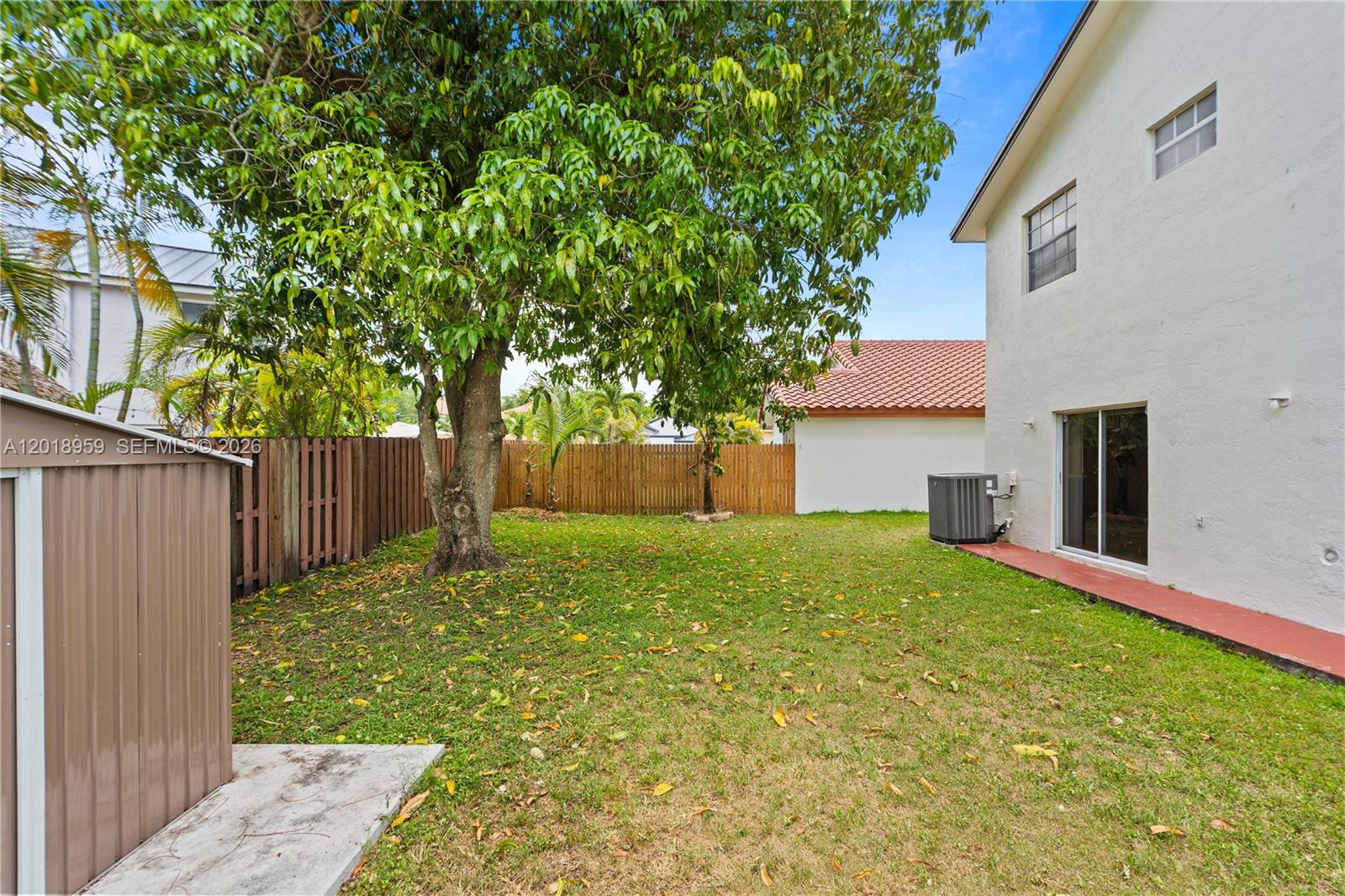 15345 Southwest 63rd Terrace Miami, FL 33193 - Photo 49 of 51 a view of a backyard with a garden