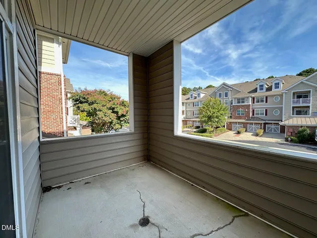 a view of balcony with furniture and city view