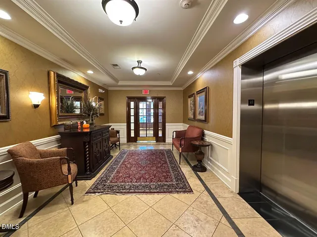 a living room with furniture rug and window