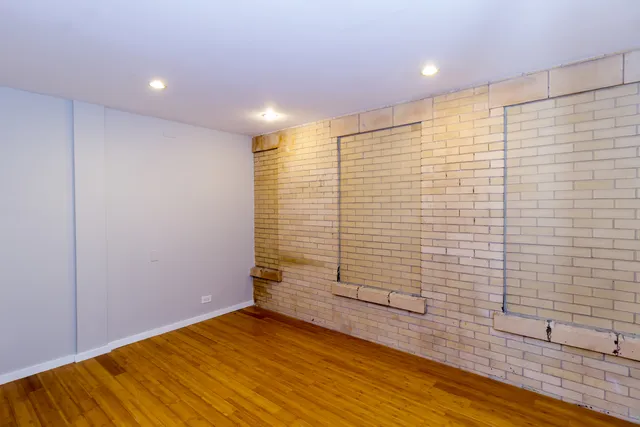 a kitchen with stainless steel appliances granite countertop a refrigerator and a stove