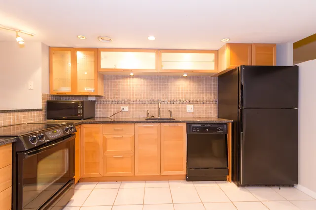 a bathroom with a sink toilet and vanity