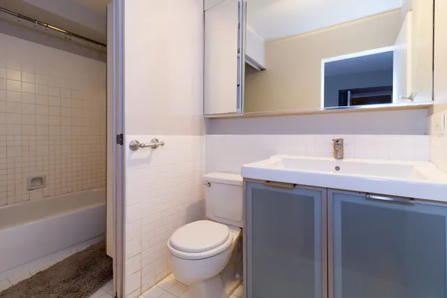 a bathroom with a tub and a shower