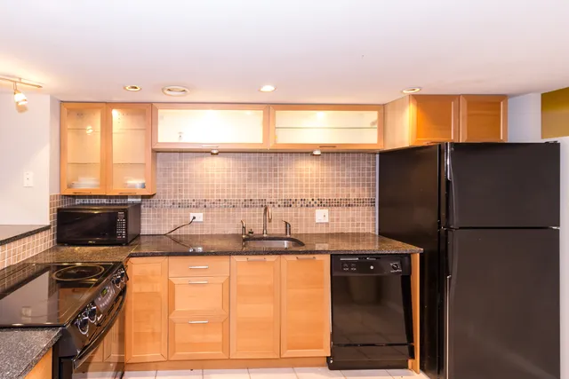 a view of a room with wooden floor and natural light