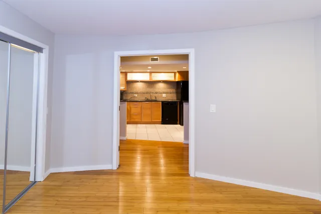 a view of a kitchen with a sink and a microwave