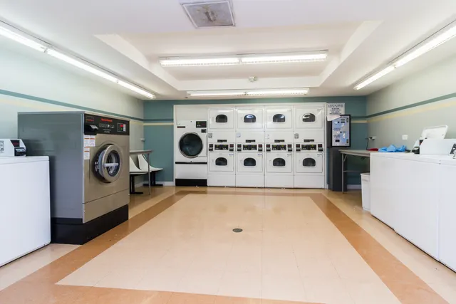 an open kitchen with a table and chairs