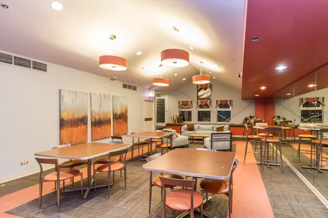 a bathroom with a mirror and shower