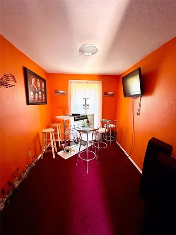 a view of a livingroom with furniture and a table