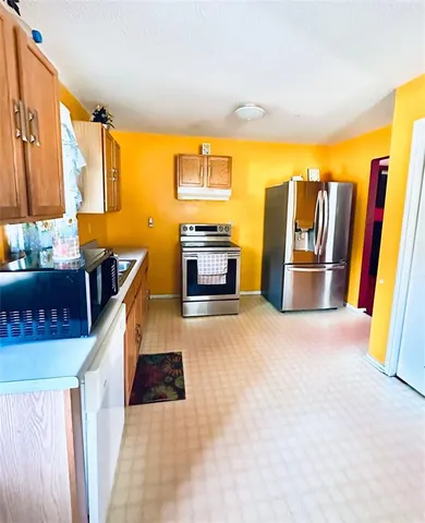 a view of a kitchen with furniture and a kitchen