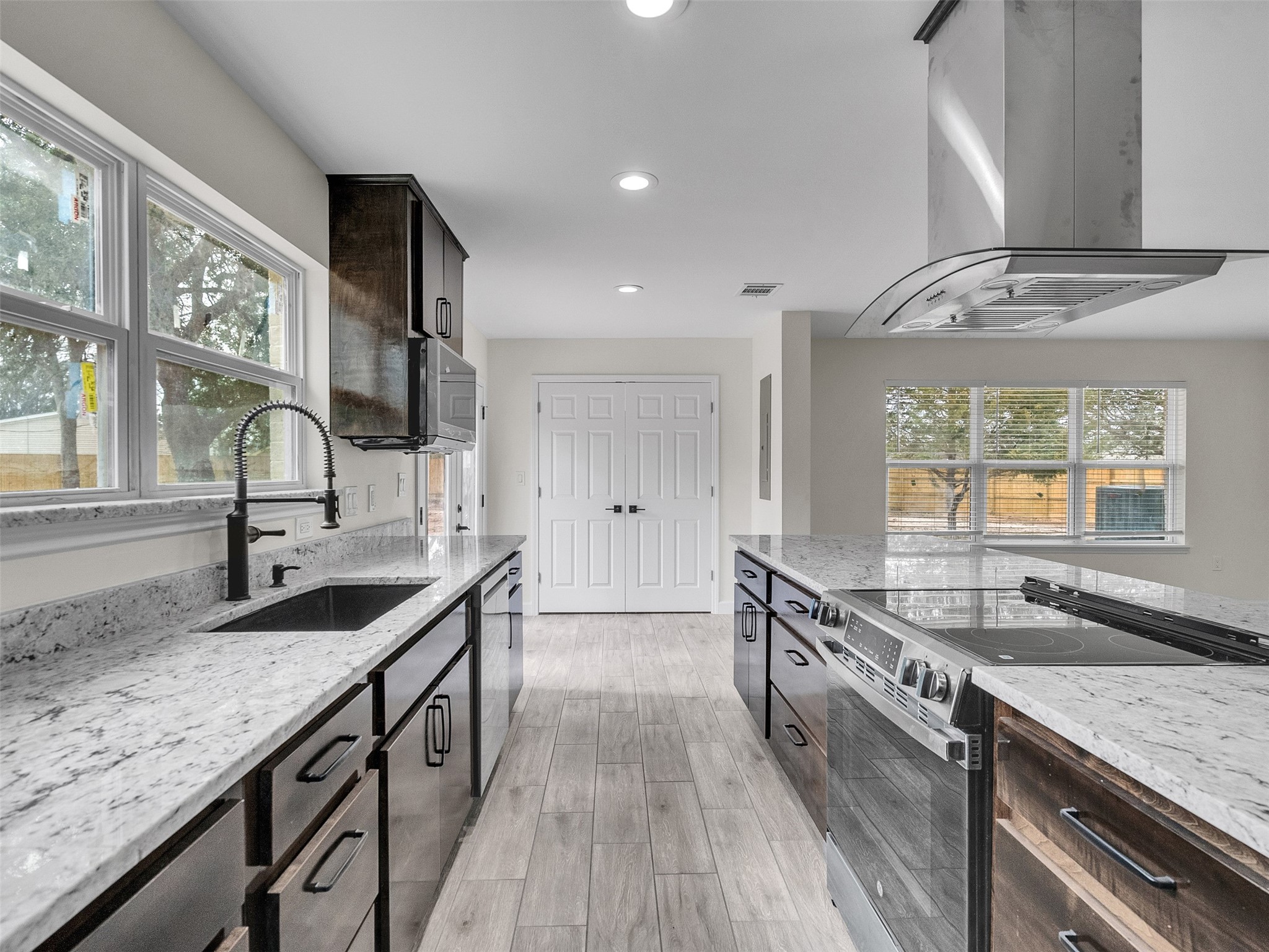 4835 County Road 380 Rosharon, TX 77583 - Photo 12 of 38 a kitchen with granite countertop a sink and a stove
