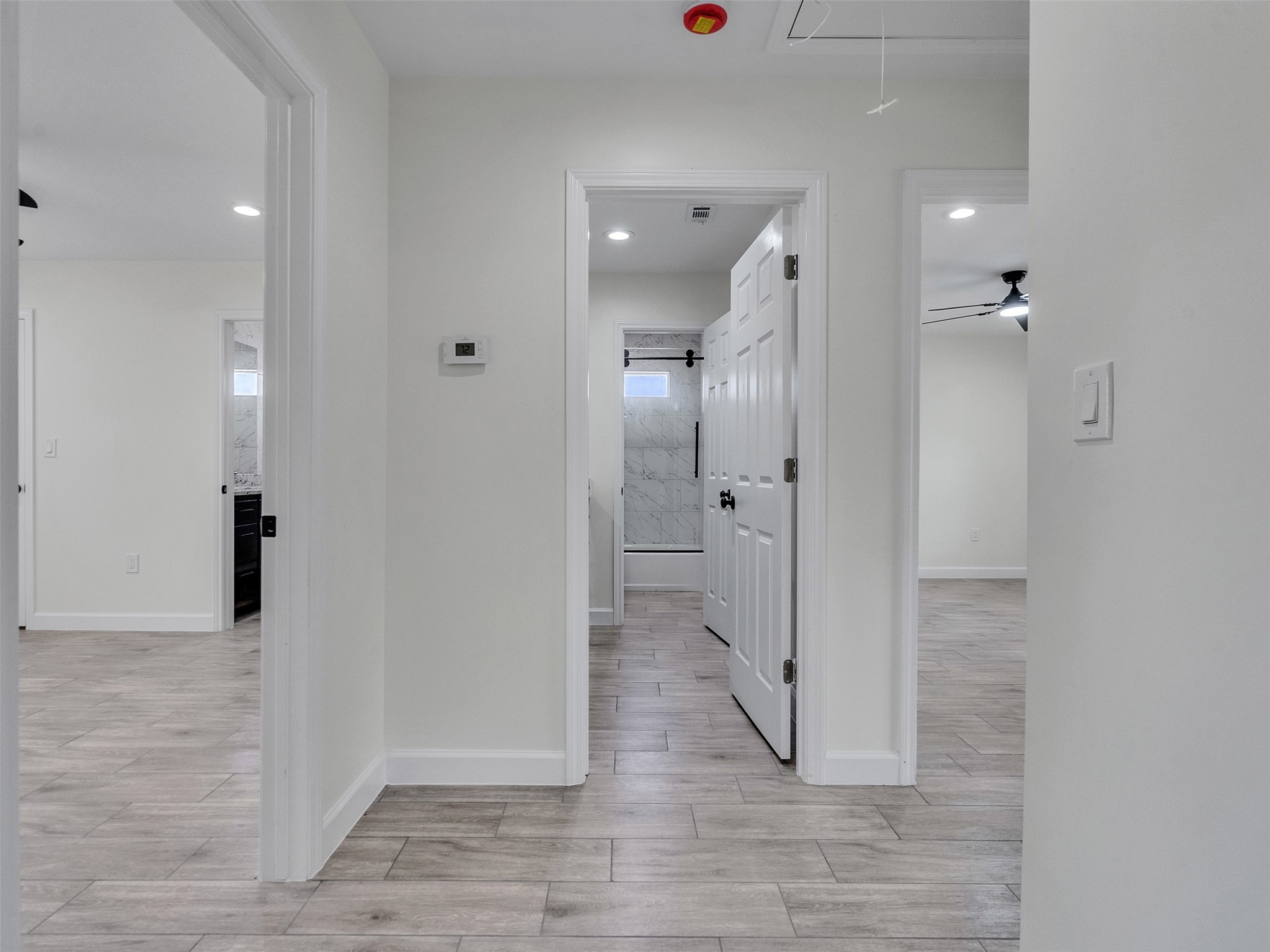 4835 County Road 380 Rosharon, TX 77583 - Photo 15 of 38 an empty room with wooden floor and mirror
