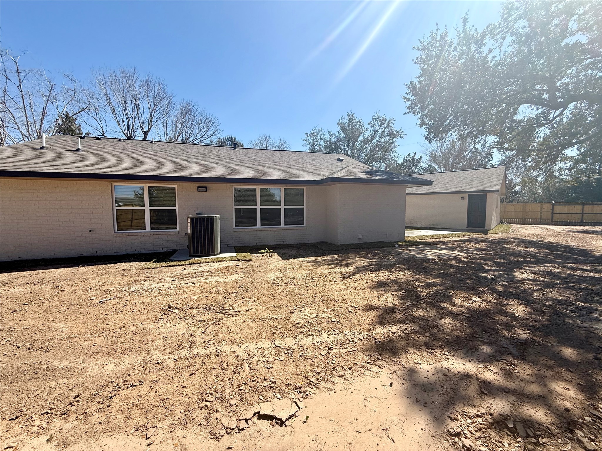 4835 County Road 380 Rosharon, TX 77583 - Photo 26 of 38 a backyard of a house with large trees