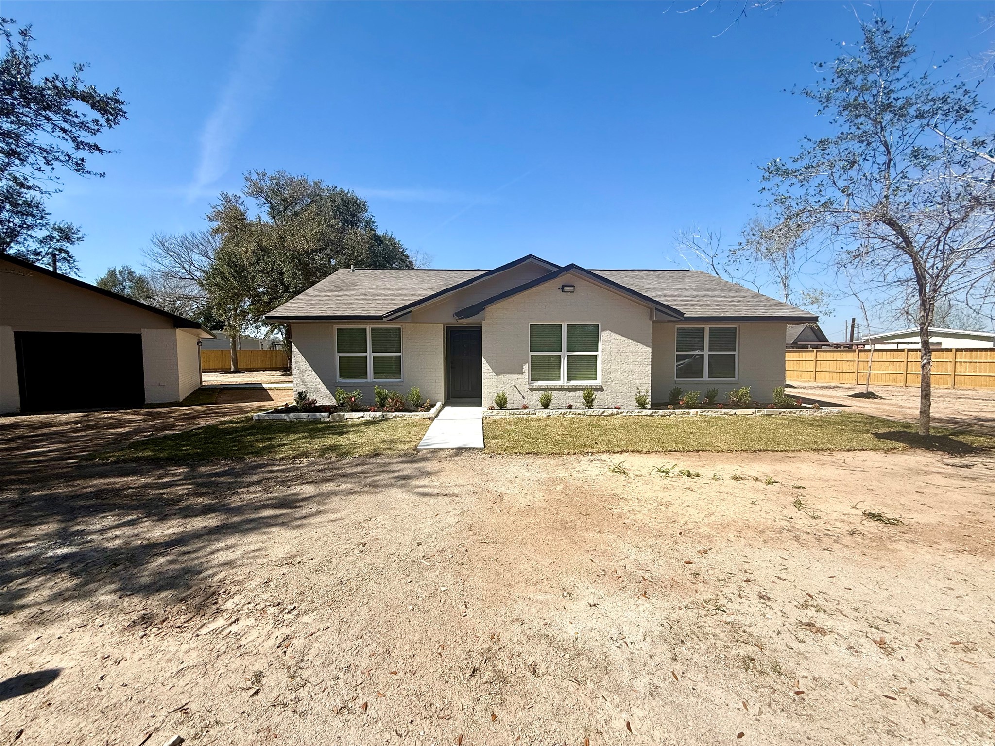 4835 County Road 380 Rosharon, TX 77583 - Photo 32 of 38 a front view of a house with a yard