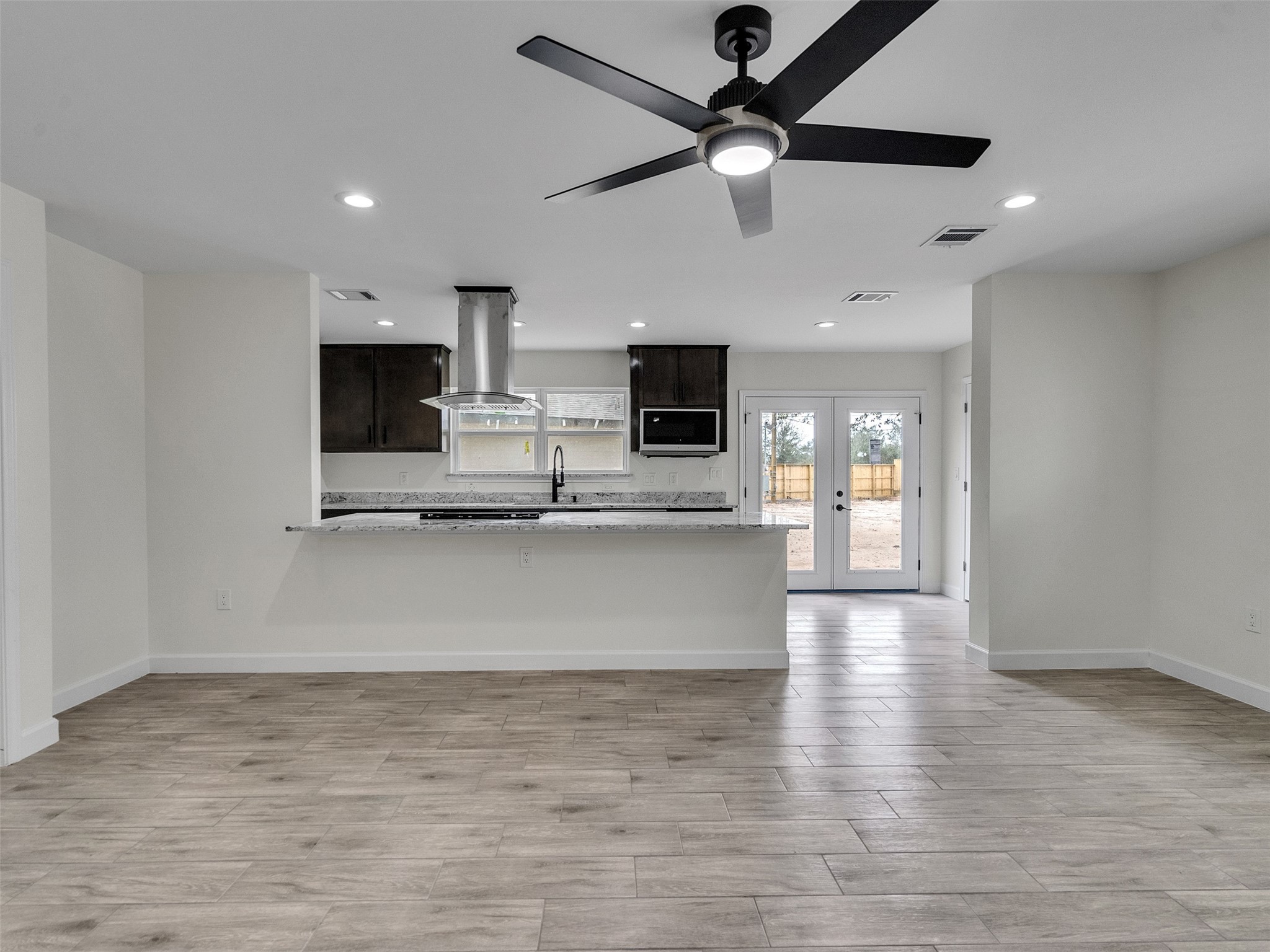 4835 County Road 380 Rosharon, TX 77583 - Photo 6 of 38 a view of kitchen with microwave and window