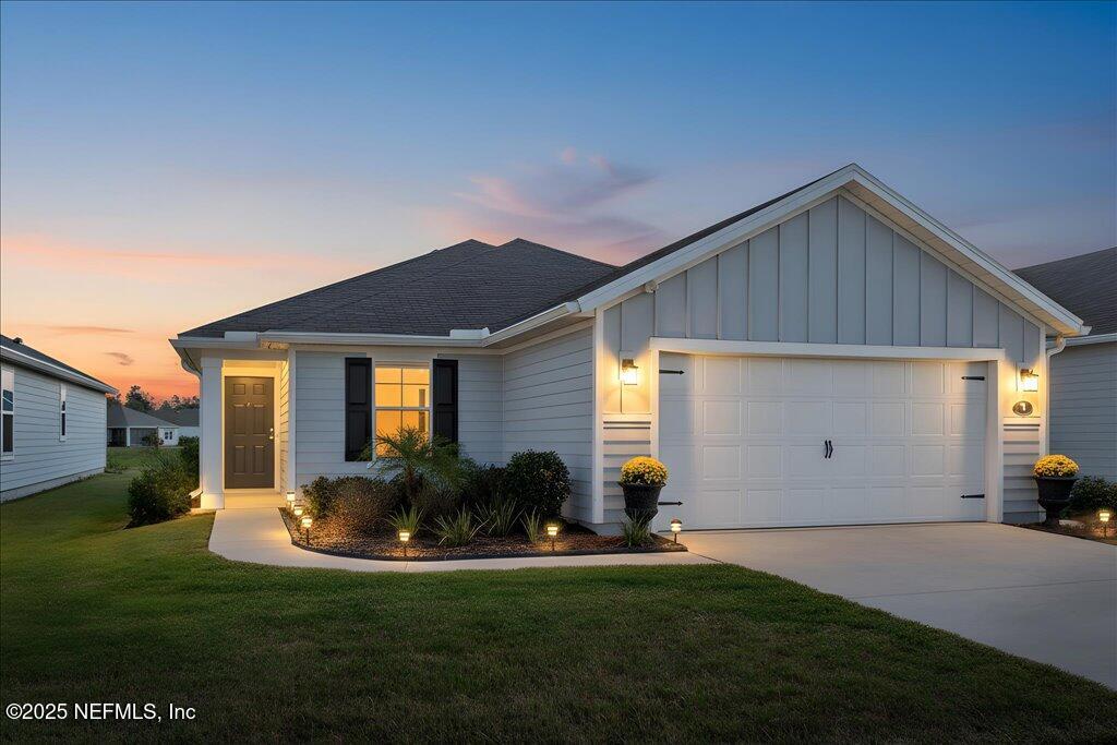 7 Windsor Place Palm Coast, FL 32164 - Photo 1 of 40 a front view of house with yard and green space