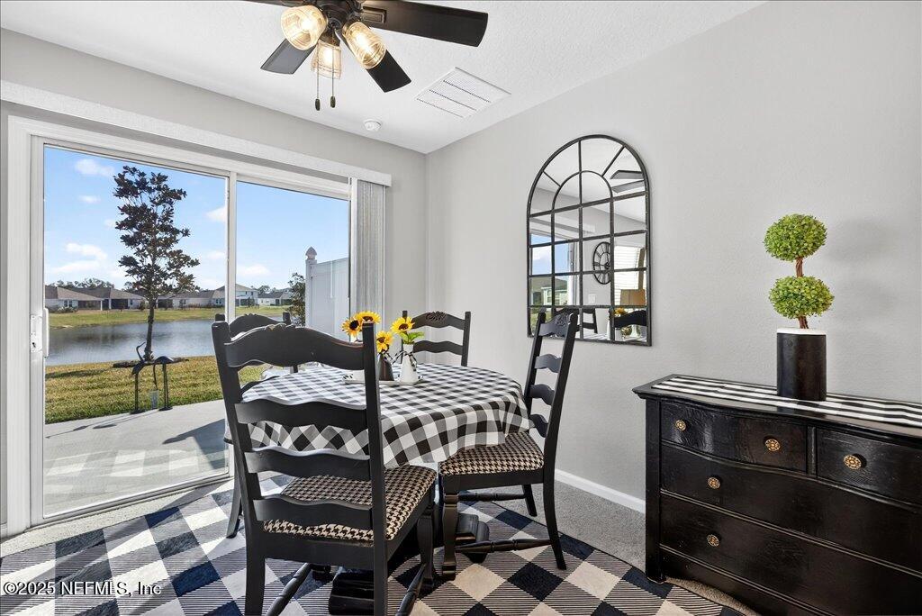 7 Windsor Place Palm Coast, FL 32164 - Photo 12 of 40 a view of a dining room with furniture window and outside view