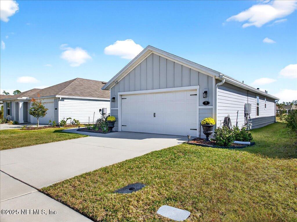 7 Windsor Place Palm Coast, FL 32164 - Photo 2 of 40 a house view with a garden space