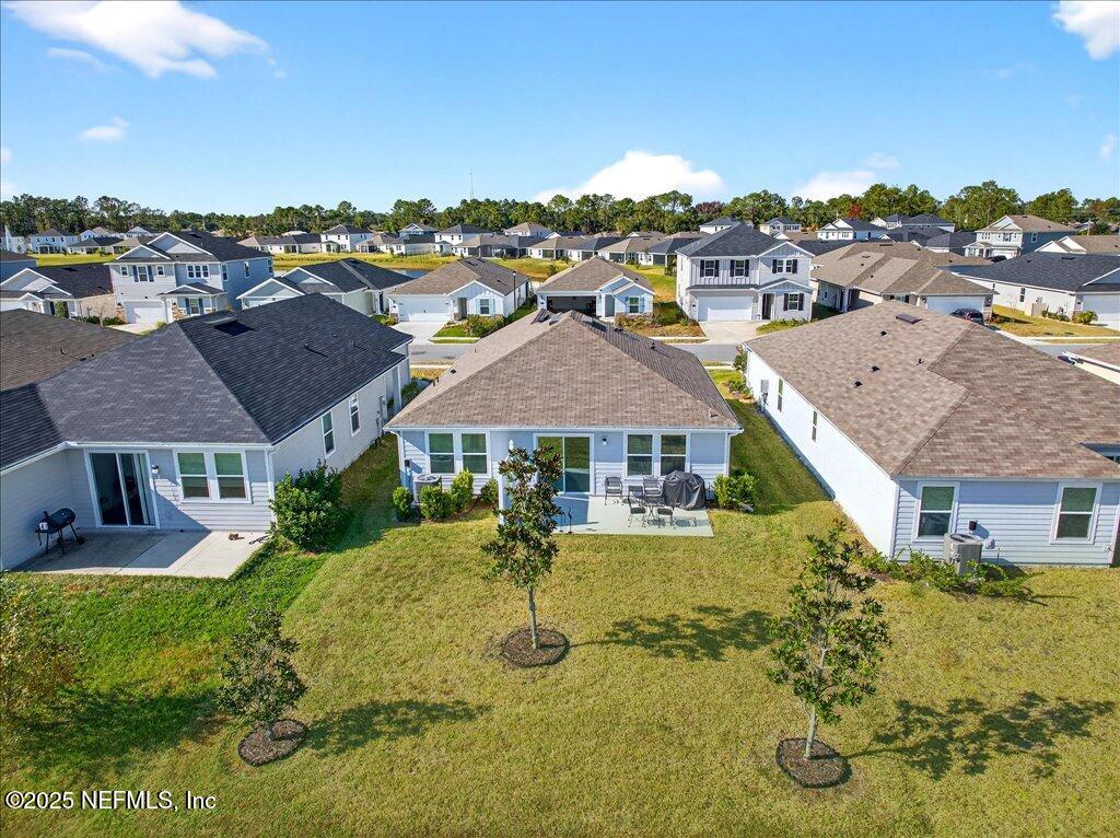 7 Windsor Place Palm Coast, FL 32164 - Photo 24 of 40 a view of a big house with a big yard and mountain view