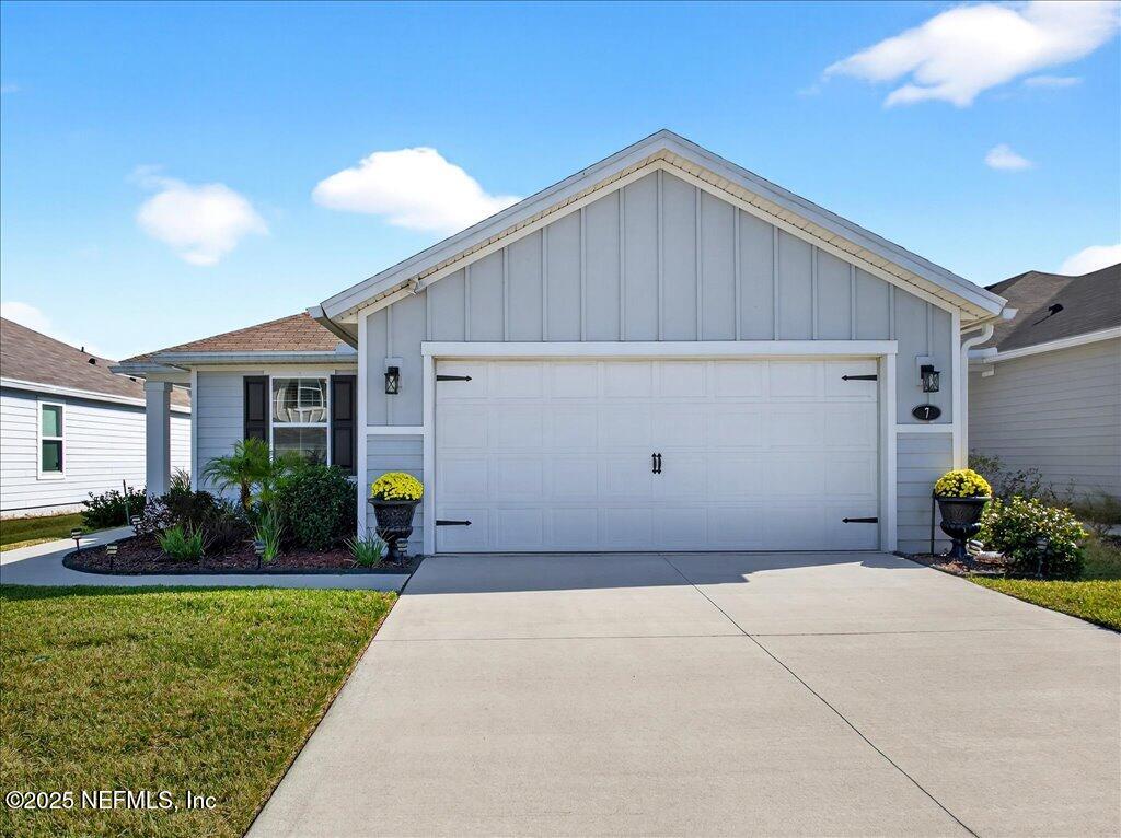 7 Windsor Place Palm Coast, FL 32164 - Photo 3 of 40 a house view with a garden space