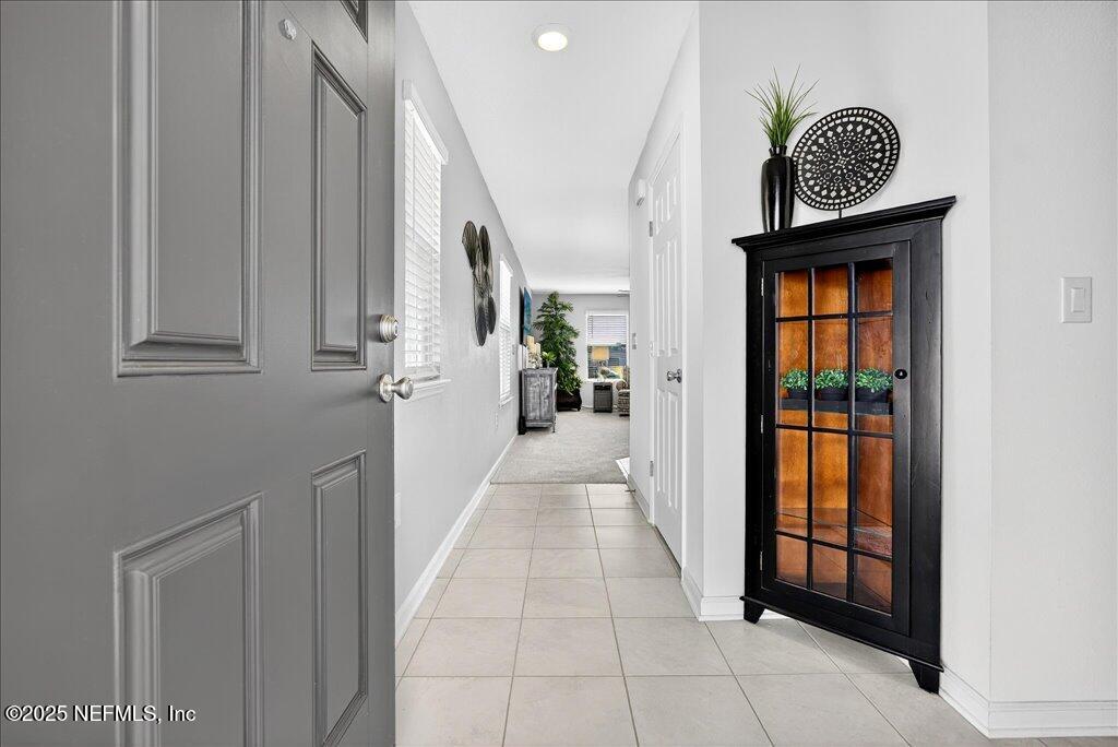 7 Windsor Place Palm Coast, FL 32164 - Photo 7 of 40 a view of a entryway door with furniture